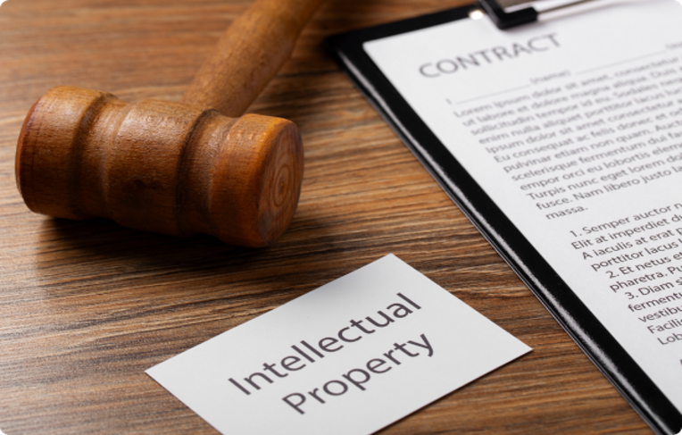 Judge’s gavel placed on an open law book representing intellectual property rights, law, and creative work protection.